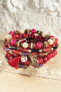 Fire seed bracelet with charm accents *