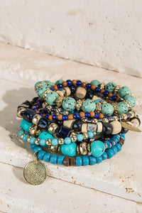 Seaside seed bracelet with charm accents