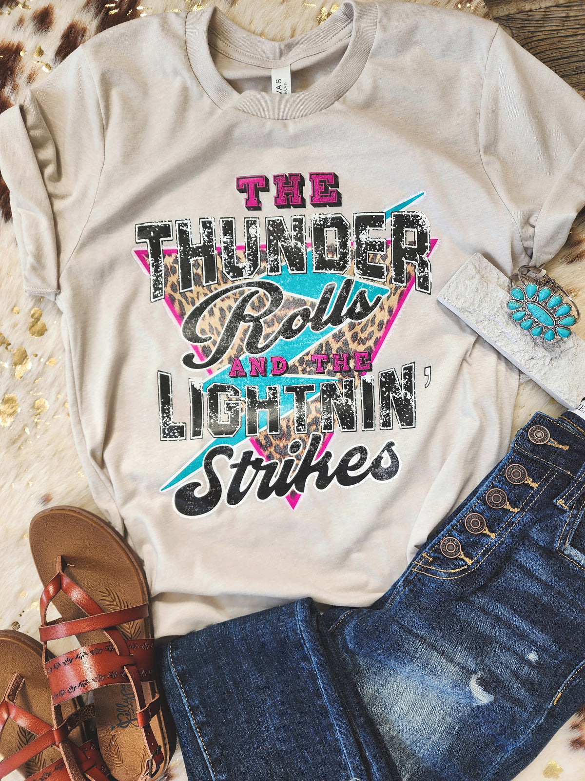 "The Thunder Rolls and the Lightnin' Strikes" graphic tee * on sale