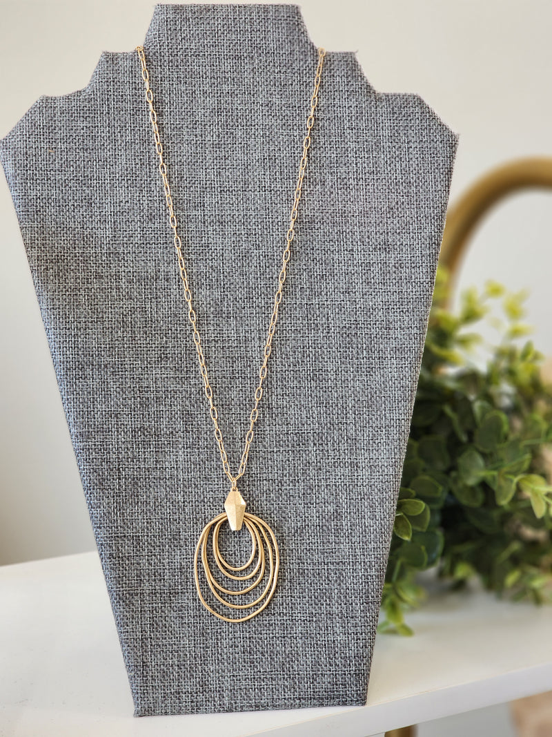 Worn gold layered hoop necklace