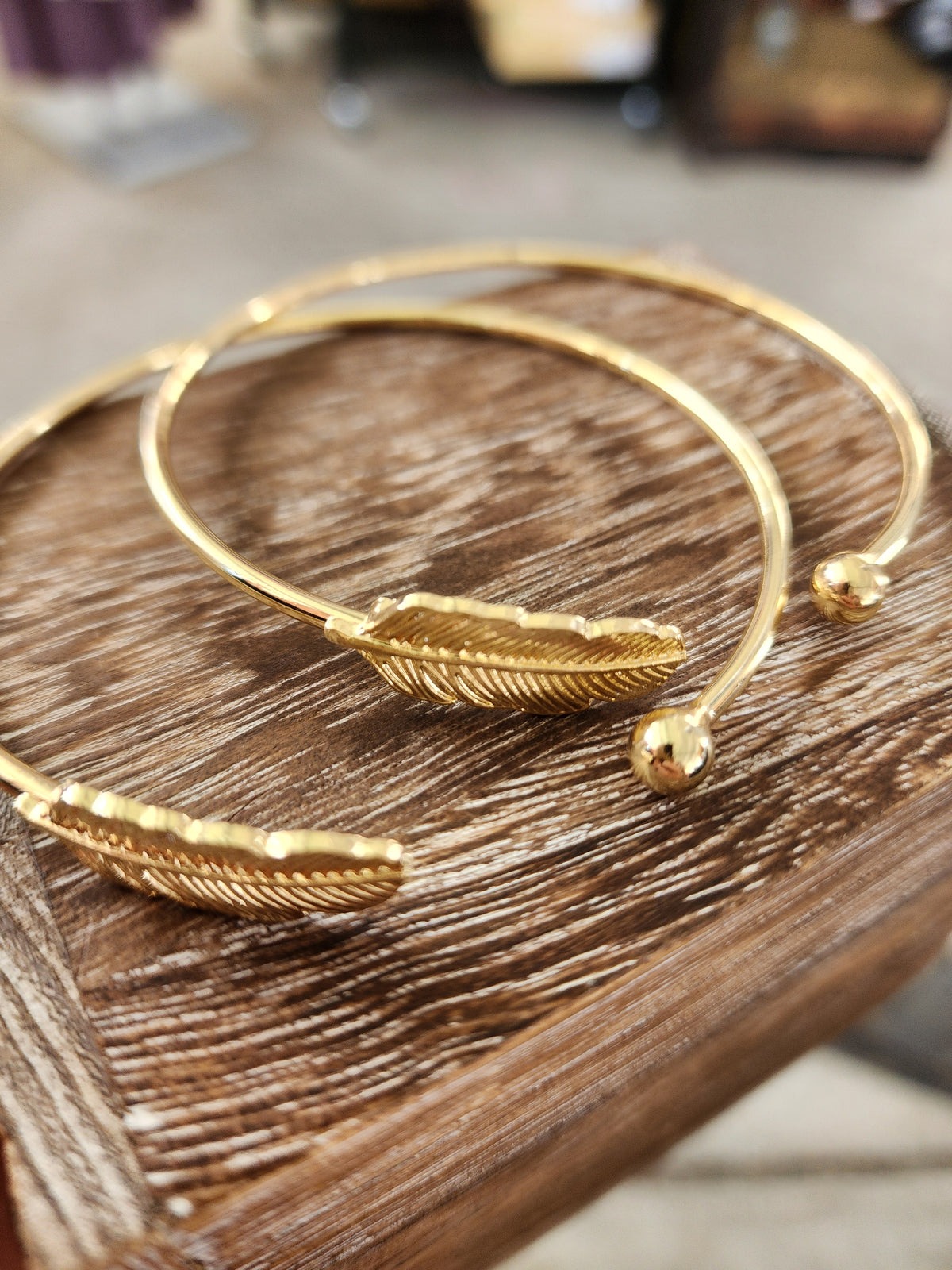 Gold feather cuff bracelet