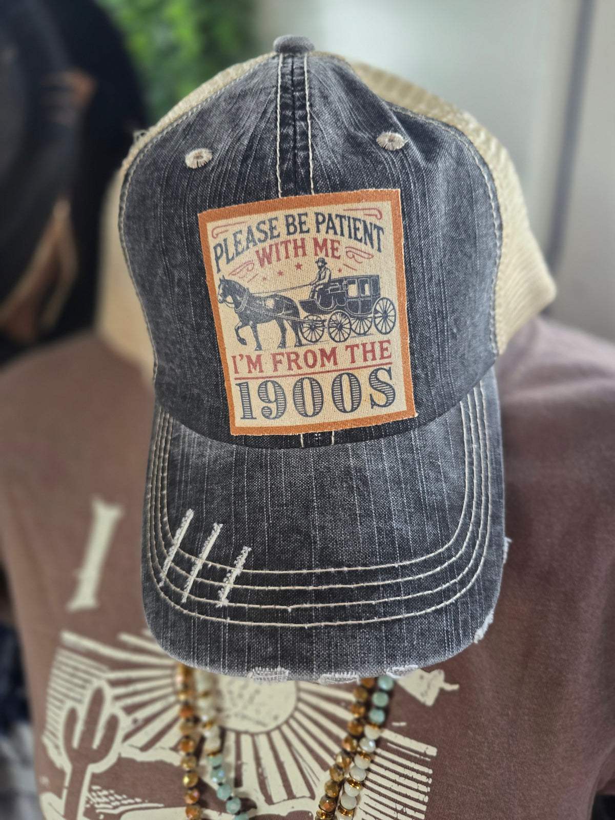 "PLEASE BE PATIENT WITH ME" DISTRESSED TRUCKER HAT  BLACK/ KHAKI