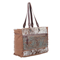 Myra Juniper Weekender Bag for Women with upcycled canvas and hairon hide with embossed leather detail