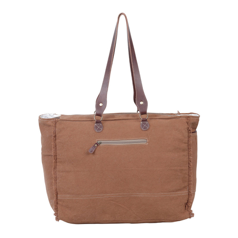 Myra Juniper Weekender Bag for Women with upcycled canvas and hairon hide with embossed leather detail