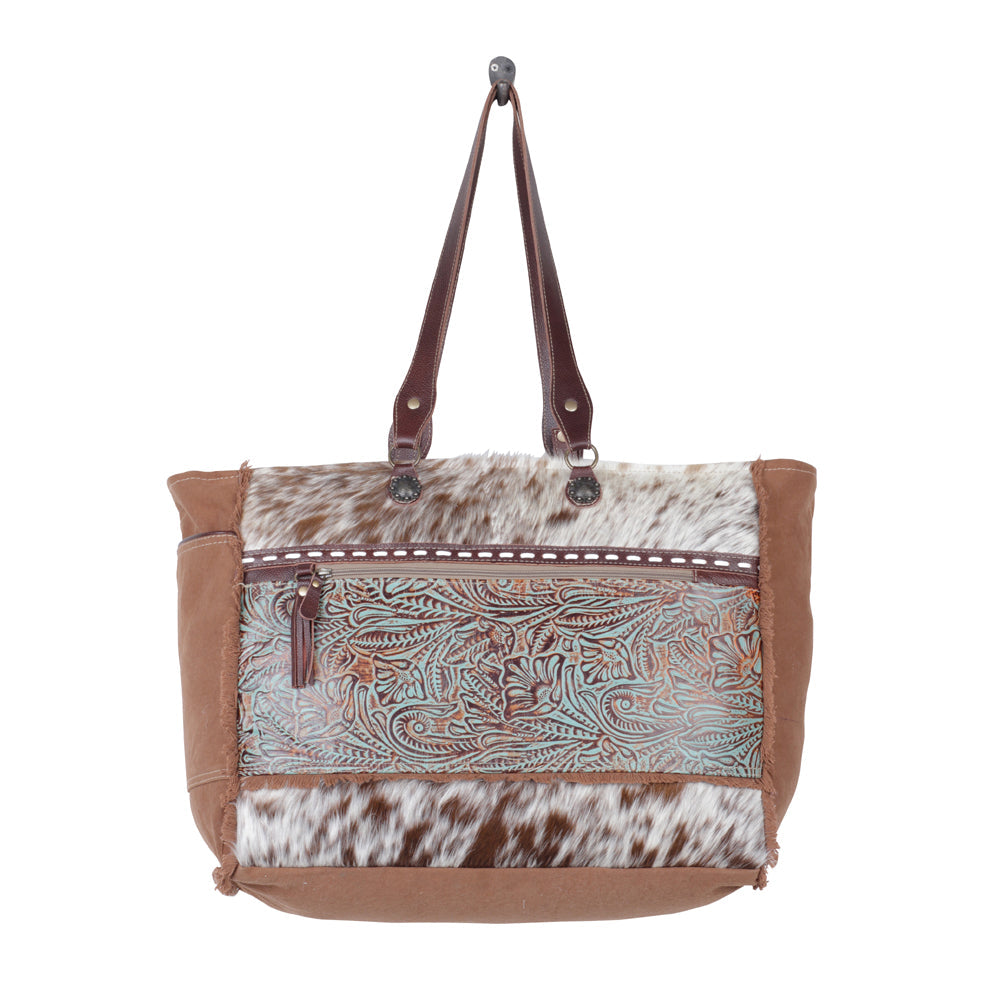 Myra Juniper Weekender Bag for Women with upcycled canvas and hairon hide with embossed leather detail