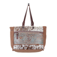 Myra Juniper Weekender Bag for Women with upcycled canvas and hairon hide with embossed leather detail