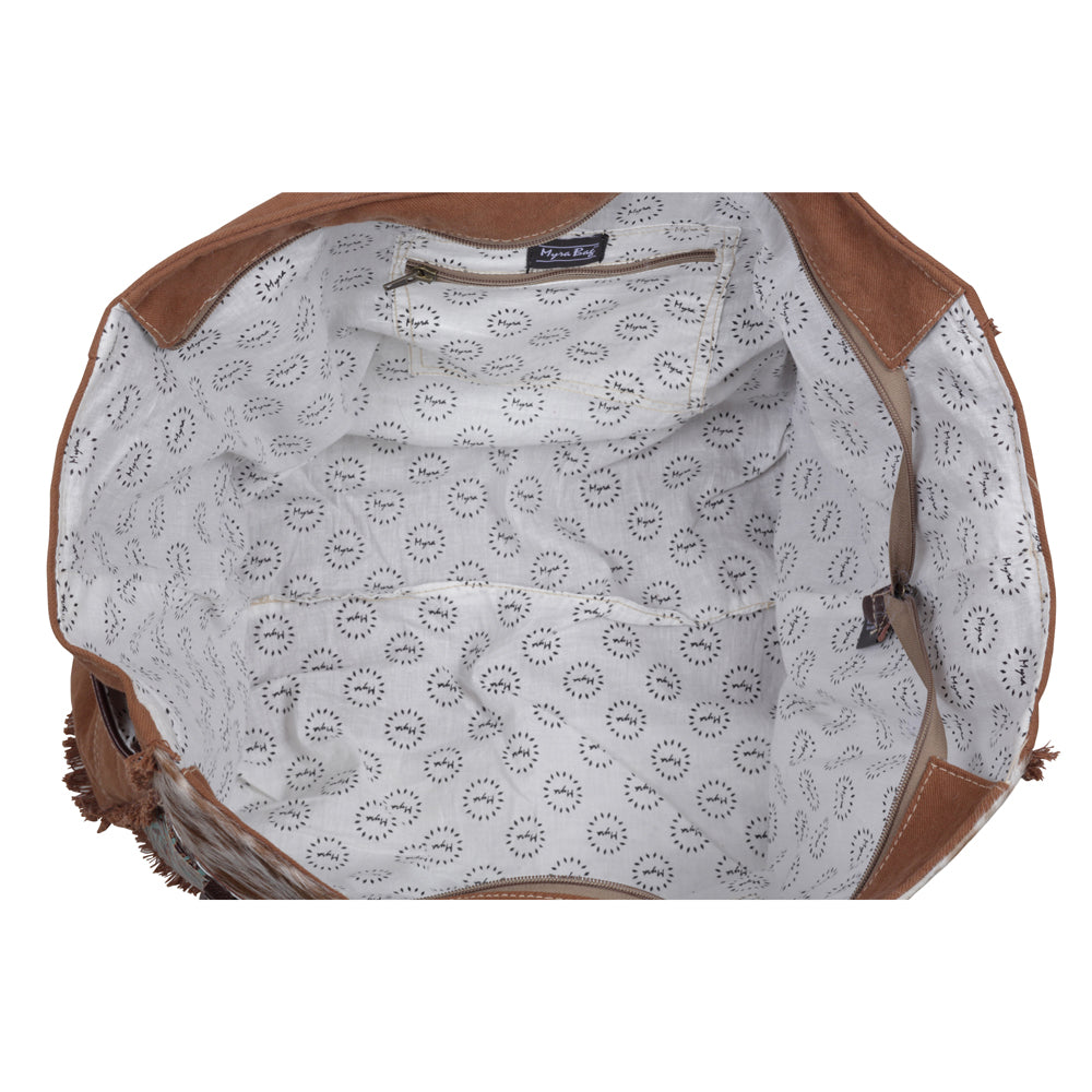 Myra Juniper Weekender Bag for Women with upcycled canvas and hairon hide with embossed leather detail