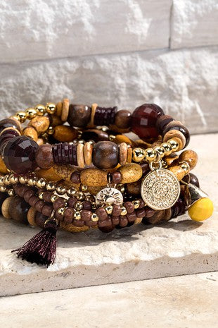 Walnut seed bracelet with charm accents